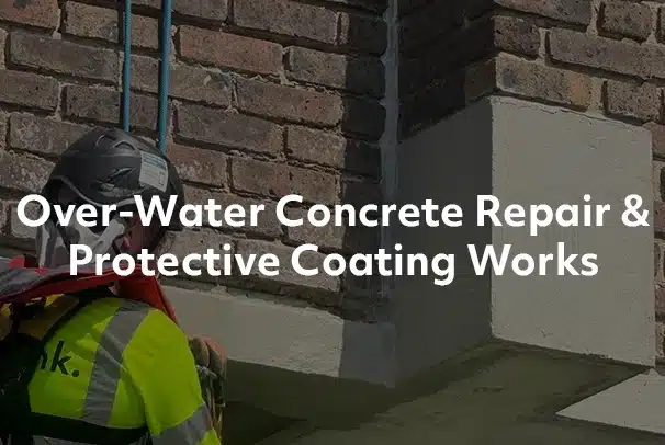 Rope access technician doing concrete repair over water