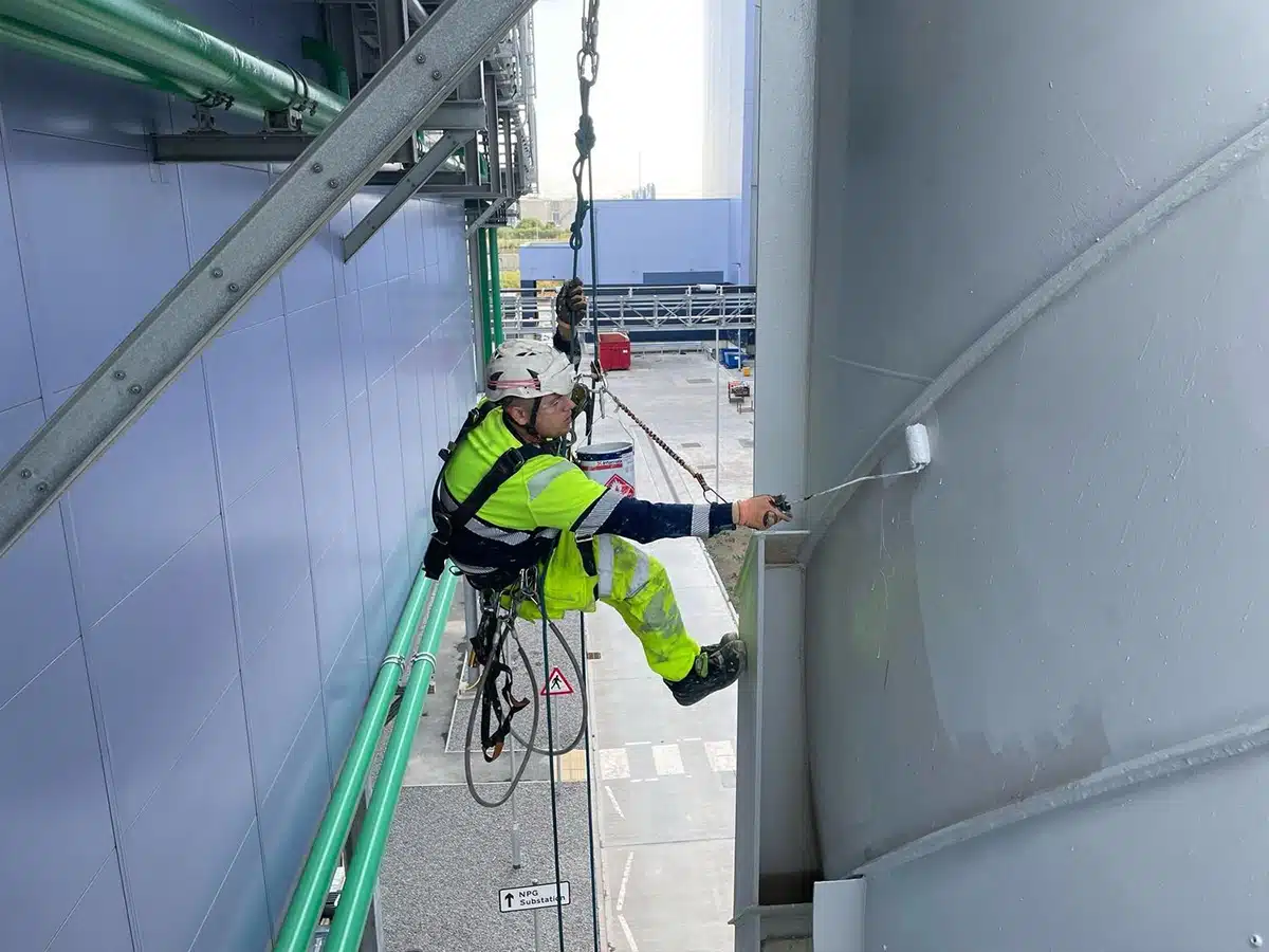 rope access operative applying industrial coatings