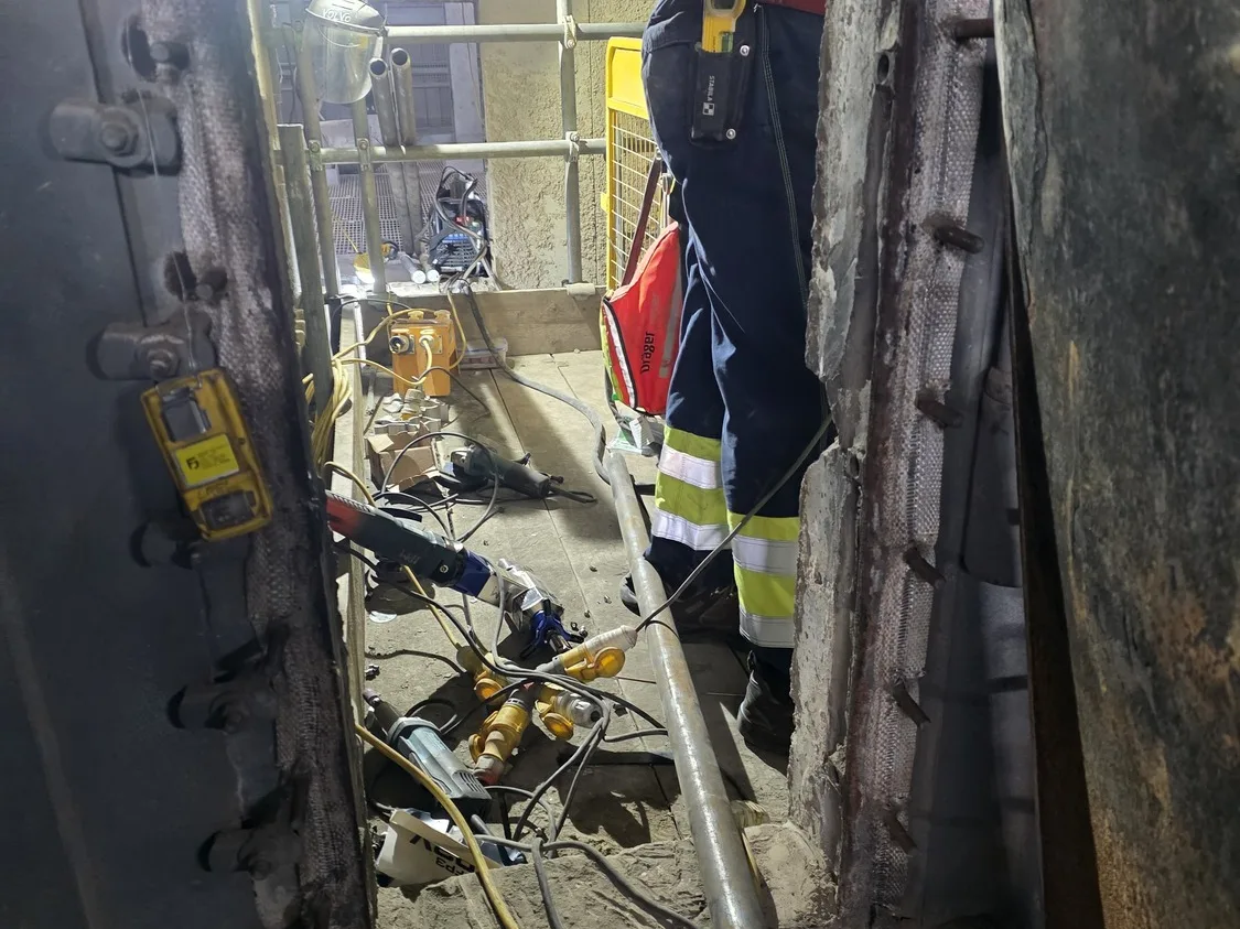 Confined space entry point with monitoring and rescue kit in place