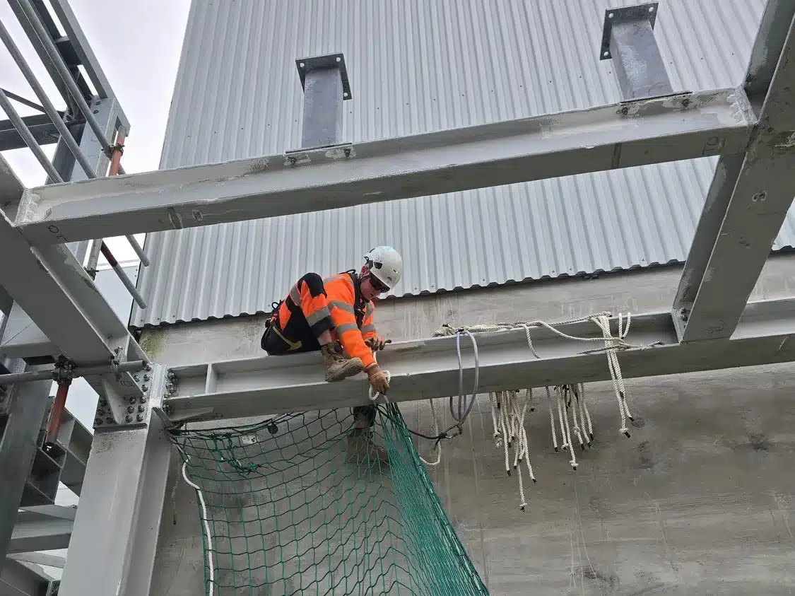 Technician installing FASET safety netting at Oldhall ERF Irvine
