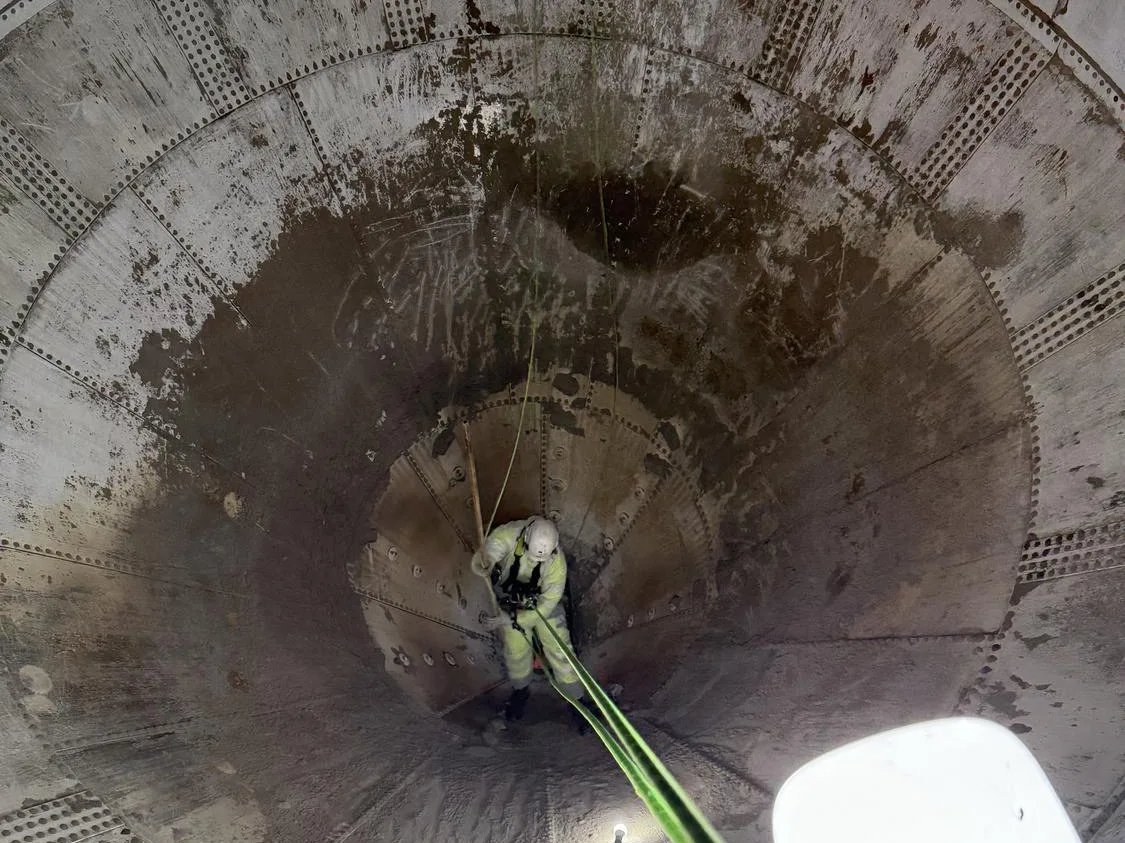 View down inside a process vessel with rope access lines rigged